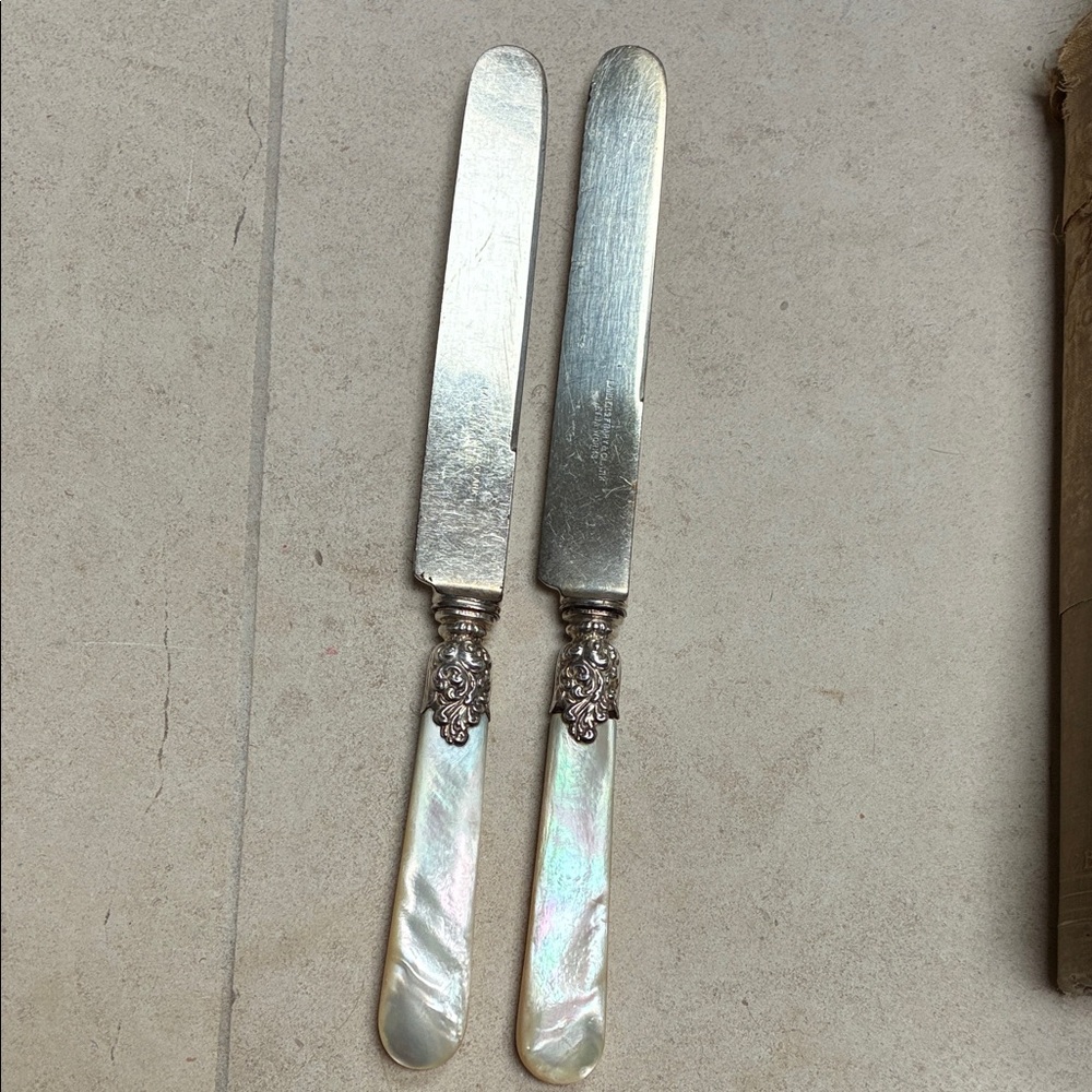 Sterling Silvered hilts and mother of Pearl handled Knives